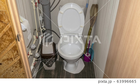 White wall toilet in toilet room and plumbing pipes 63996665