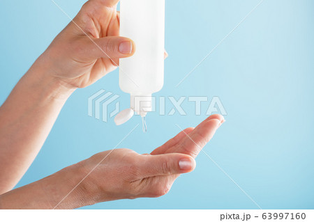 A bottle of Disinfectant gel in your hands on a 63997160