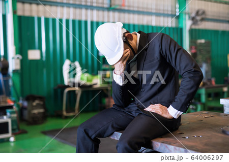Cry factory businessman due to covid-19 global 64006297