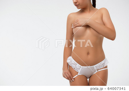 Crop sexy female covering breast touching lingerie 64007341