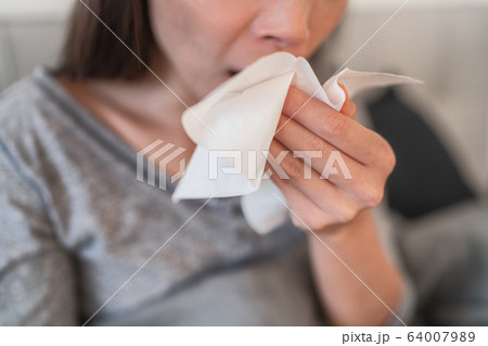 Cough in tissue covering nose and mouth when coughing as COVID-19 hygiene guidelines for coronavirus spread prevention Cough in tissue covering nose and mouth when coughing as COVID-19 hygiene guidelines for coronavirus spread prevention 64007989