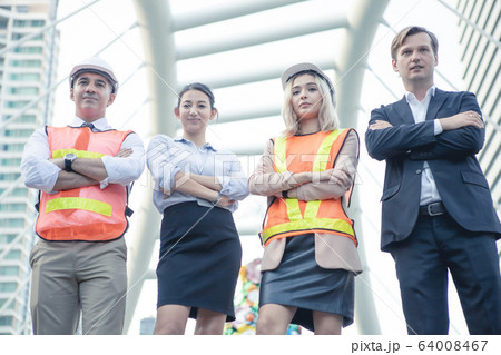 Successful group of businessmen and engineers with 64008467