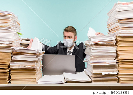 A male accountant or company manager works in an A male accountant or company manager works in an 64012392
