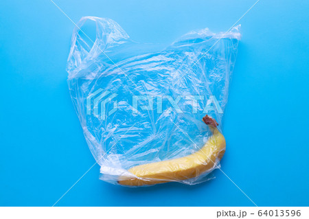 Plastic pollution, fresh banana in plastic bag 64013596