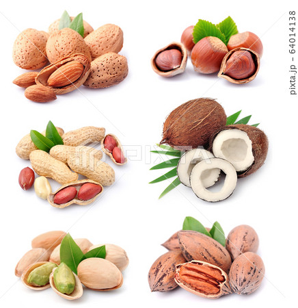 Collage of nuts . Coconut, peanut, filbert, pecan,almonds isolated on white backgrounds. Collage of nuts . Coconut, peanut, filbert, pecan,almonds isolated on white backgrounds. 64014138