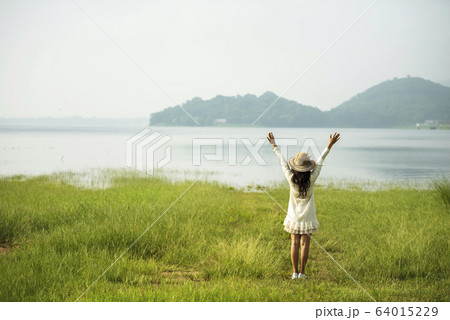Back side woman feeling fresh freedom positive 64015229