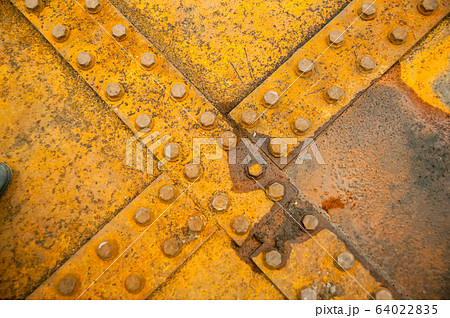 Rusty nut at the surface of steel plate closeup Rusty nut at the surface of steel plate closeup 64022835