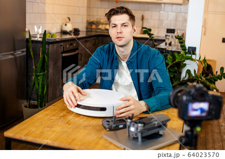 blogger presenting his new purchase, new device 64023570
