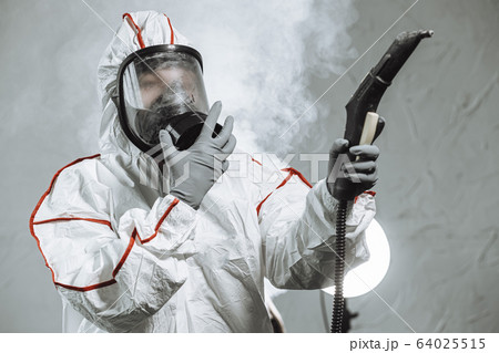 professional disinfector fully armed with necessary equipment 64025515