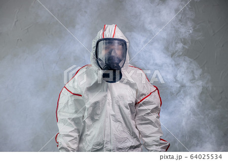 portrait of unrecognizable disinfector in gas-mask 64025534