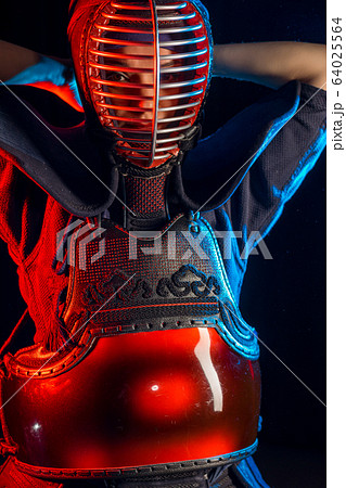 young female kendo fighter wearing mask young female kendo fighter wearing mask 64025564