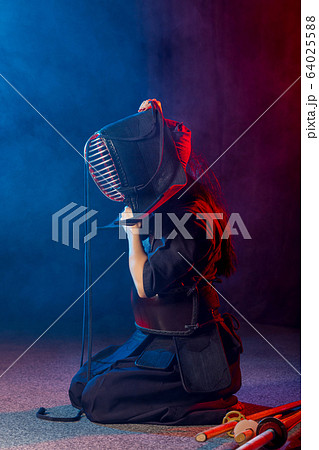 young female kendo fighter wearing mask young female kendo fighter wearing mask 64025588