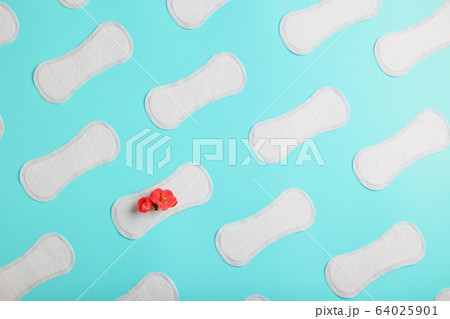 Many Sanitary pads on a blue background in the 64025901