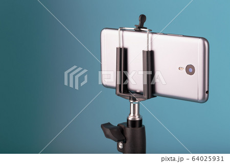 Smartphone on a tripod as a photo-video camera on 64025931