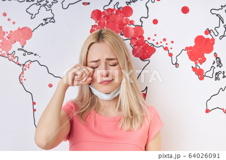 sad girl cry about situation in the world during coronavirus pandemic sad girl cry about situation in the world during coronavirus pandemic 64026091