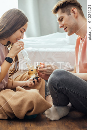 caucasian couple enjoy taking drugs together caucasian couple enjoy taking drugs together 64026121