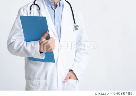 Focus on tablet for notes in hands of doctor 64030489