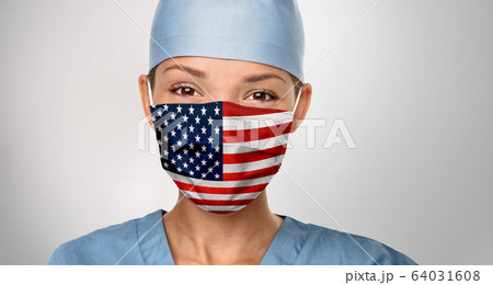 USA American doctor wearing Coronavirus pandemic COVID-19 mask in the United States of America. American flag print on Asian woman doctor's mask smiling in confidence giving hope 64031608