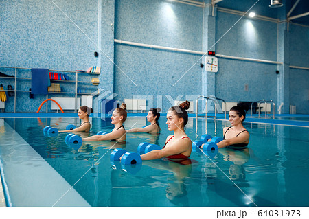 Female swimmers group, aqua aerobics in the pool Female swimmers group, aqua aerobics in the pool 64031973