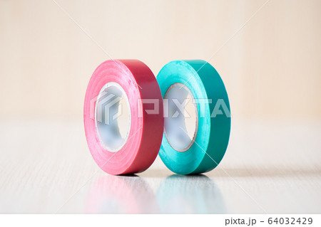 Red and green insulating tapes to insulate twisted of electrical wires. Red and green insulating tapes to insulate twisted of electrical wires. 64032429