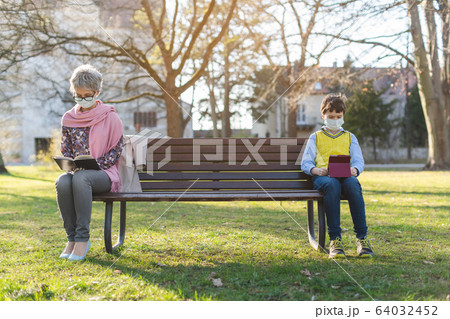 Grandmother and grandson separated by social distancing 64032452