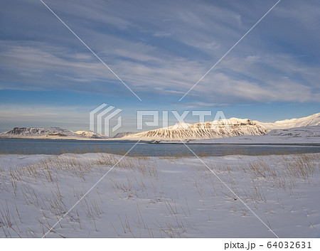 A snowy meadow on the coast of Iceland A snowy meadow on the coast of Iceland 64032631