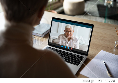 Medical insurer provide consultation to old client online by videoconference 64033778