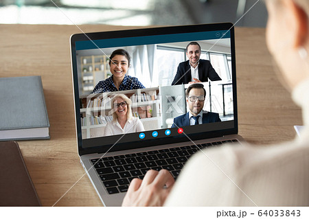 Computer screen view diverse businesspeople negotiating distantly using videocall Computer screen view diverse businesspeople negotiating distantly using videocall 64033843