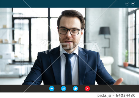Businessman talking with client by video call, computer screen view Businessman talking with client by video call, computer screen view 64034430