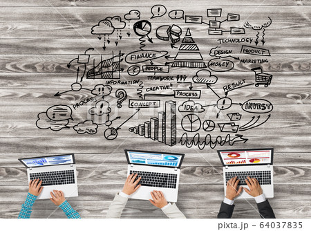 Top view of businesspeople sitting at table and using gadgets Top view of businesspeople sitting at table and using gadgets 64037835