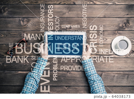 Close view of woman in checked shirt at her workplace 64038173