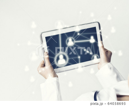 Close of female doctor hands working with tablet pc computer Close of female doctor hands working with tablet pc computer 64038693