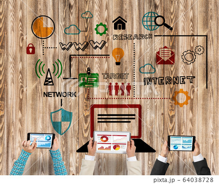 Top view of businesspeople sitting at table and using gadgets Top view of businesspeople sitting at table and using gadgets 64038728