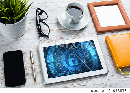 Web security and technology concept with tablet pc on wooden table Web security and technology concept with tablet pc on wooden table 64038833