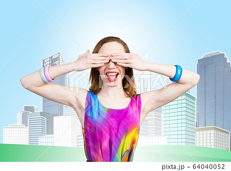 Redhead beautiful girl closing her eyes with hands Redhead beautiful girl closing her eyes with hands 64040052