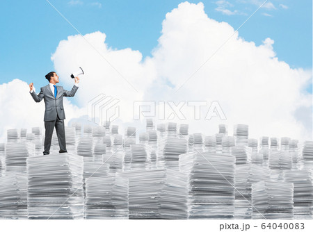 Businessman standing with megaphone. 64040083