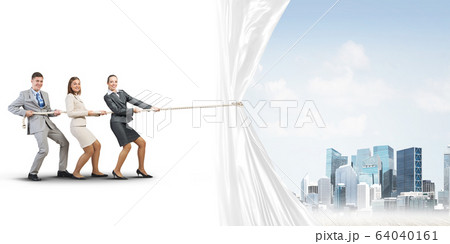 Young businesspeople working in collaboration and pulling white advertisement banner Young businesspeople working in collaboration and pulling white advertisement banner 64040161