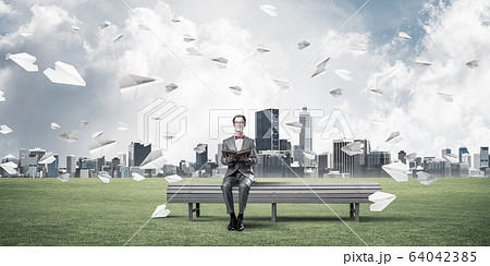 Young businessman or student studying the science and paper plan 64042385