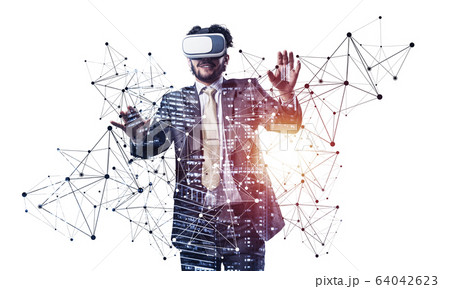 Businessman wearing VR headset working 64042623