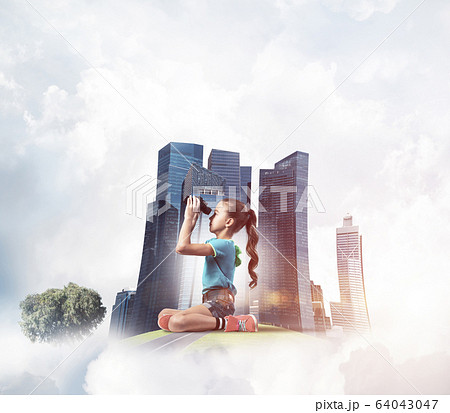 Concept of careless happy childhood with girl looking in future 64043047