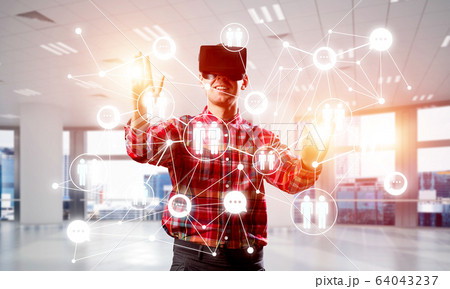 Guy wearing checked shirt and virtual mask reaching hand to touch screen Guy wearing checked shirt and virtual mask reaching hand to touch screen 64043237