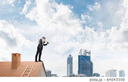 Mister boss on brick roof in search of something new. Mixed media 64043500