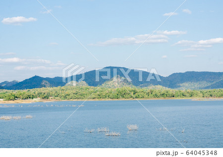 peaceful landscape of lake with mountain view in Thailand peaceful landscape of lake with mountain view in Thailand 64045348
