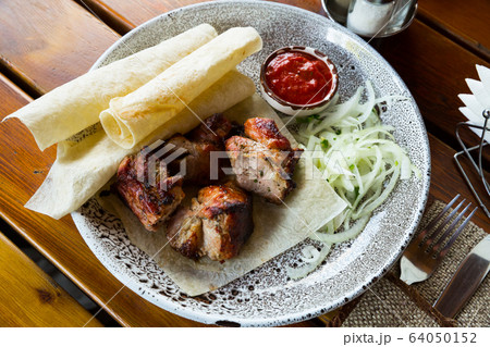 Oriental grilled pork meat shashlik Oriental grilled pork meat shashlik 64050152