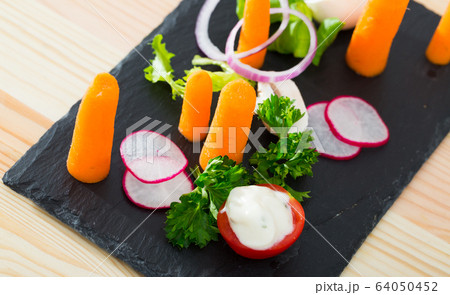 Raw vegetables with baby carrots Raw vegetables with baby carrots 64050452
