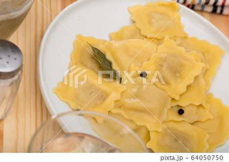 Ravioli on white plate 64050750