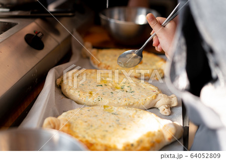 Culinary master class. Closeup of people hands Culinary master class. Closeup of people hands 64052809