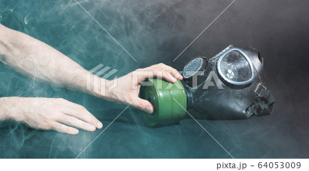 Man in room filled with smoke, trying to reach for Man in room filled with smoke, trying to reach for 64053009