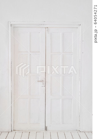 Old-style white wooden door. interior apartment. Wooden floor made of planks Old-style white wooden door. interior apartment. Wooden floor made of planks 64054271