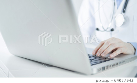 Woman doctor working with laptop in hospital Woman doctor working with laptop in hospital 64057942